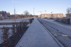 York-Quartier in Gremmendorf im März 2023. Rechts der im Bau befindliche Bereich Gartenwohnen, links Quartiersparkplätze. Blickrichtung zum Albersloher Weg.